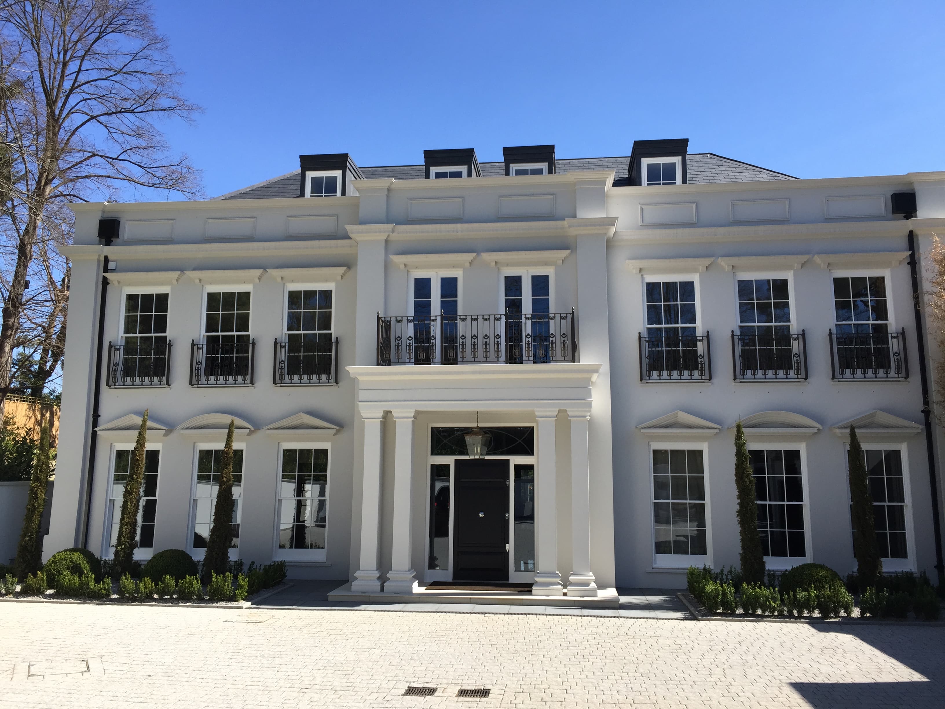 Completed Taylormade Facades project — portico with columns and coordinated elevation detailing