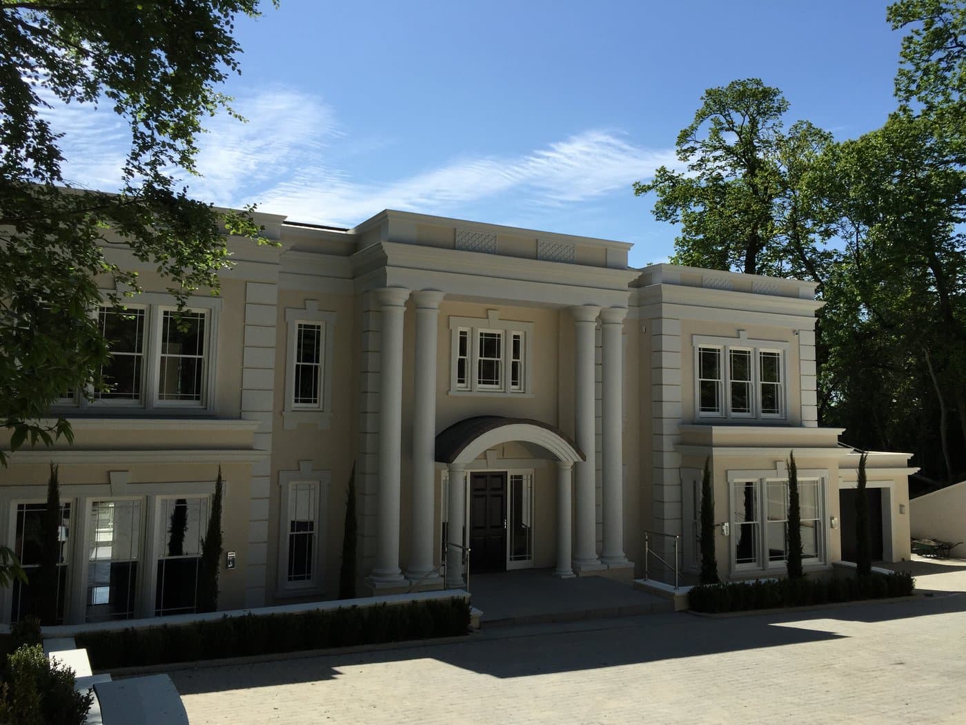 Front elevation of the St George’s Hill self-build residence in Surrey with full-height portico columns and cornice profiles.